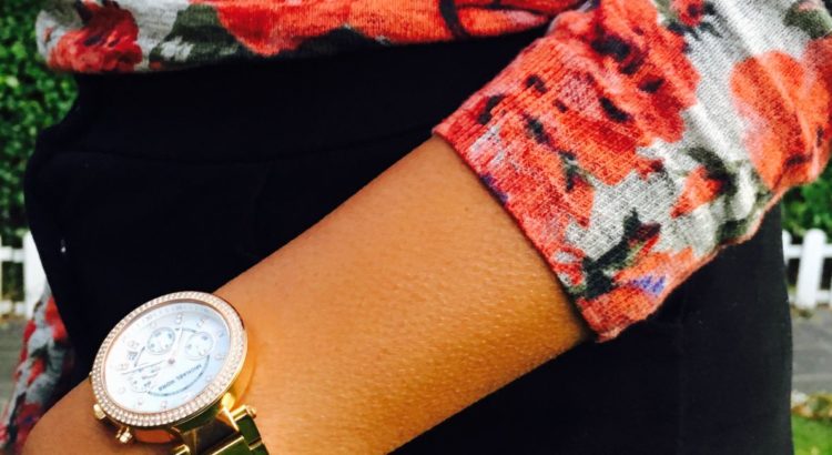Floral knit with black buttoned skirt and michael kors watch