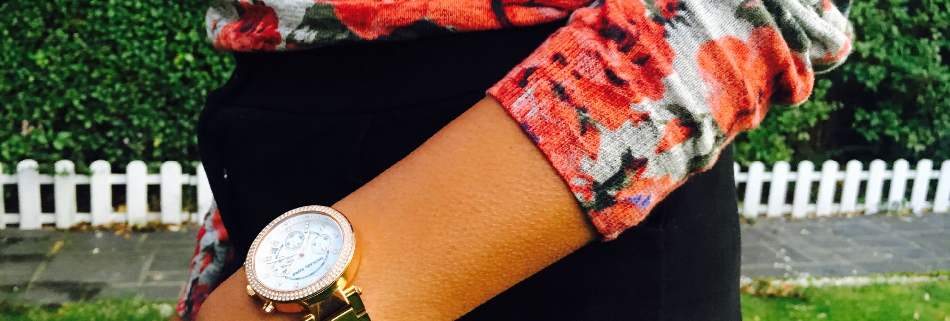Floral knit with black buttoned skirt and michael kors watch